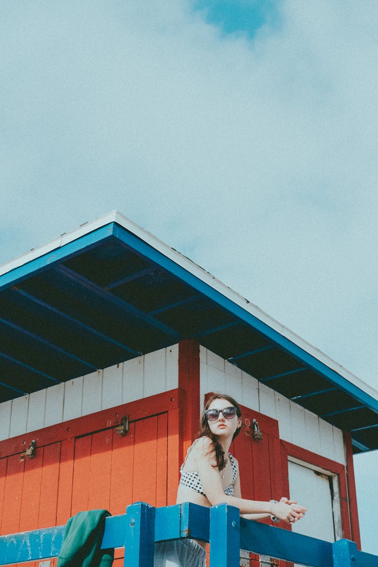 Woman Wearing Sunglasses In Lifeguard Booth