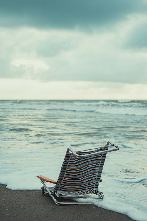 Folding Chair on Beach Shore 