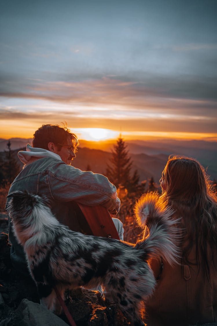 Man Serenading On Woman Under Sunset 