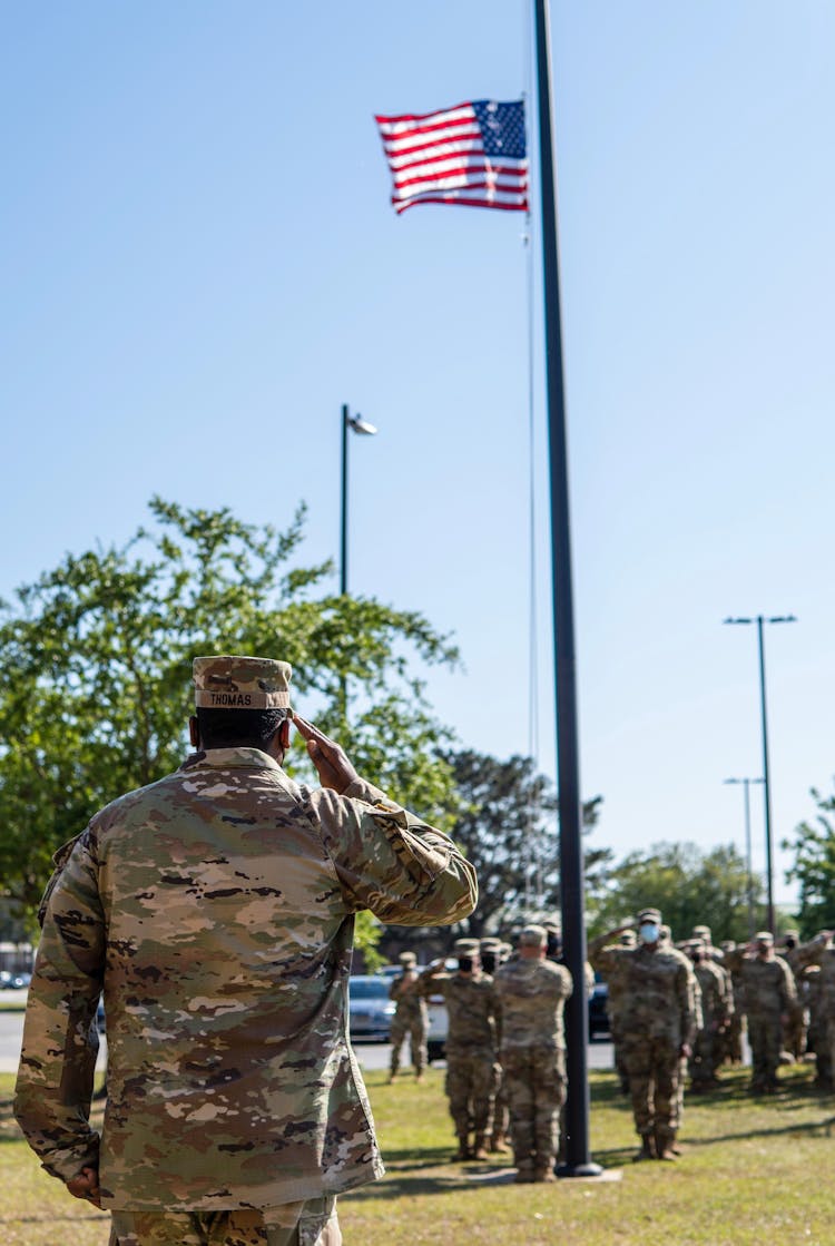 Soldiers Saluting Flag