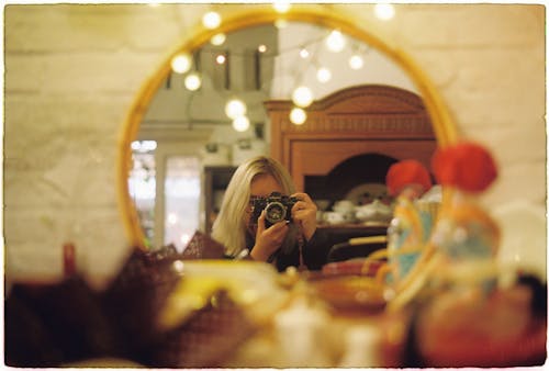 Woman Taking Picture in Mirror