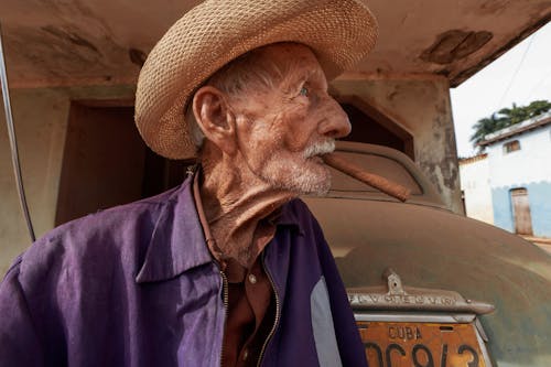 Portrait of an Elderly Man with a Brown Cigar