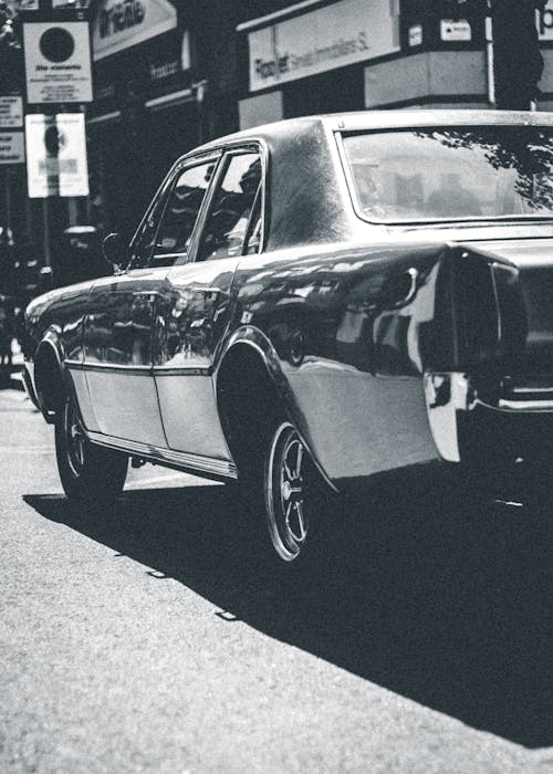 Black and White Photo of a Vintage Car