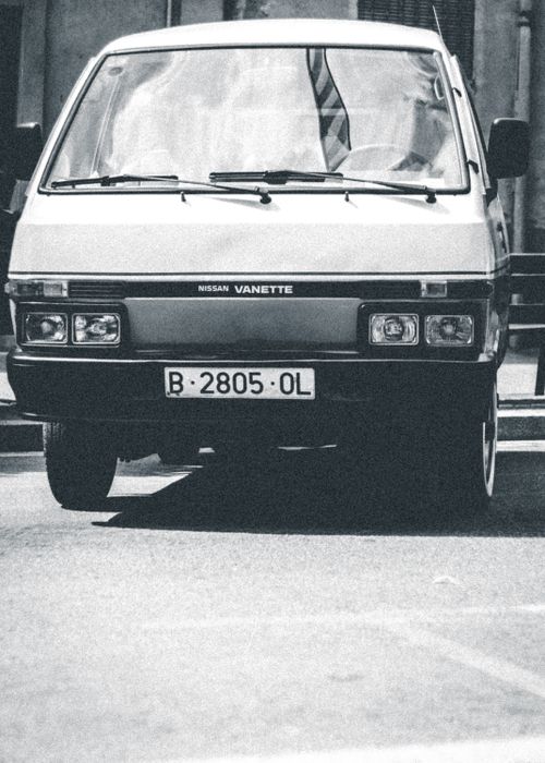 Free Classic Nissan Vanette captured in monochrome, reflecting vintage automotive style. Stock Photo
