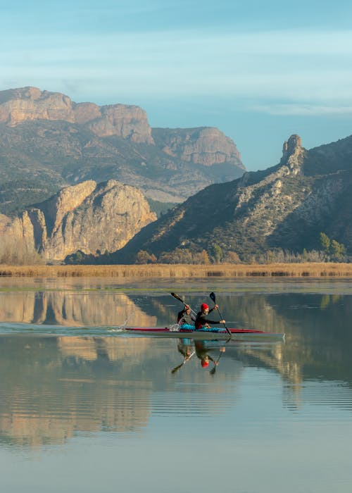 2 Persons Riding a Kayak