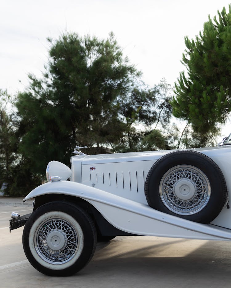 Photograph Of A White Car With Tires