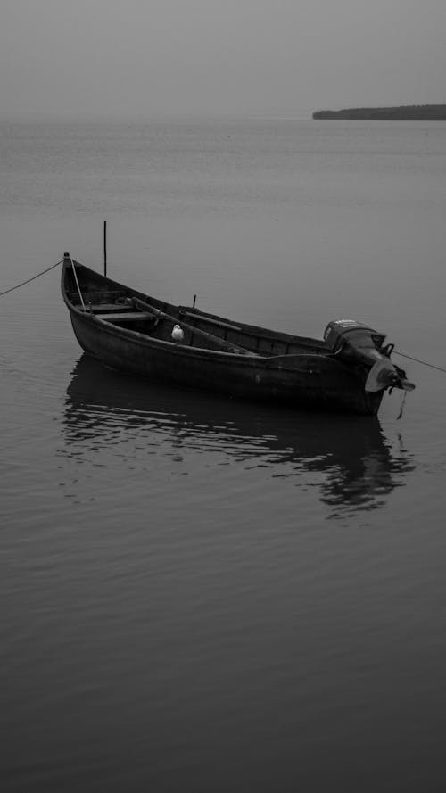 Wooden Motor Boat on Body of water