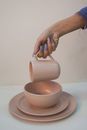 Person Pouring Milk on White Ceramic Teacup
