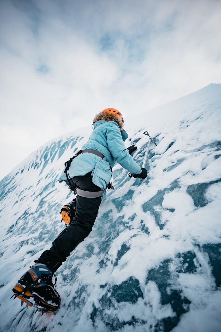 Mountaineer Climbing Ice Wall