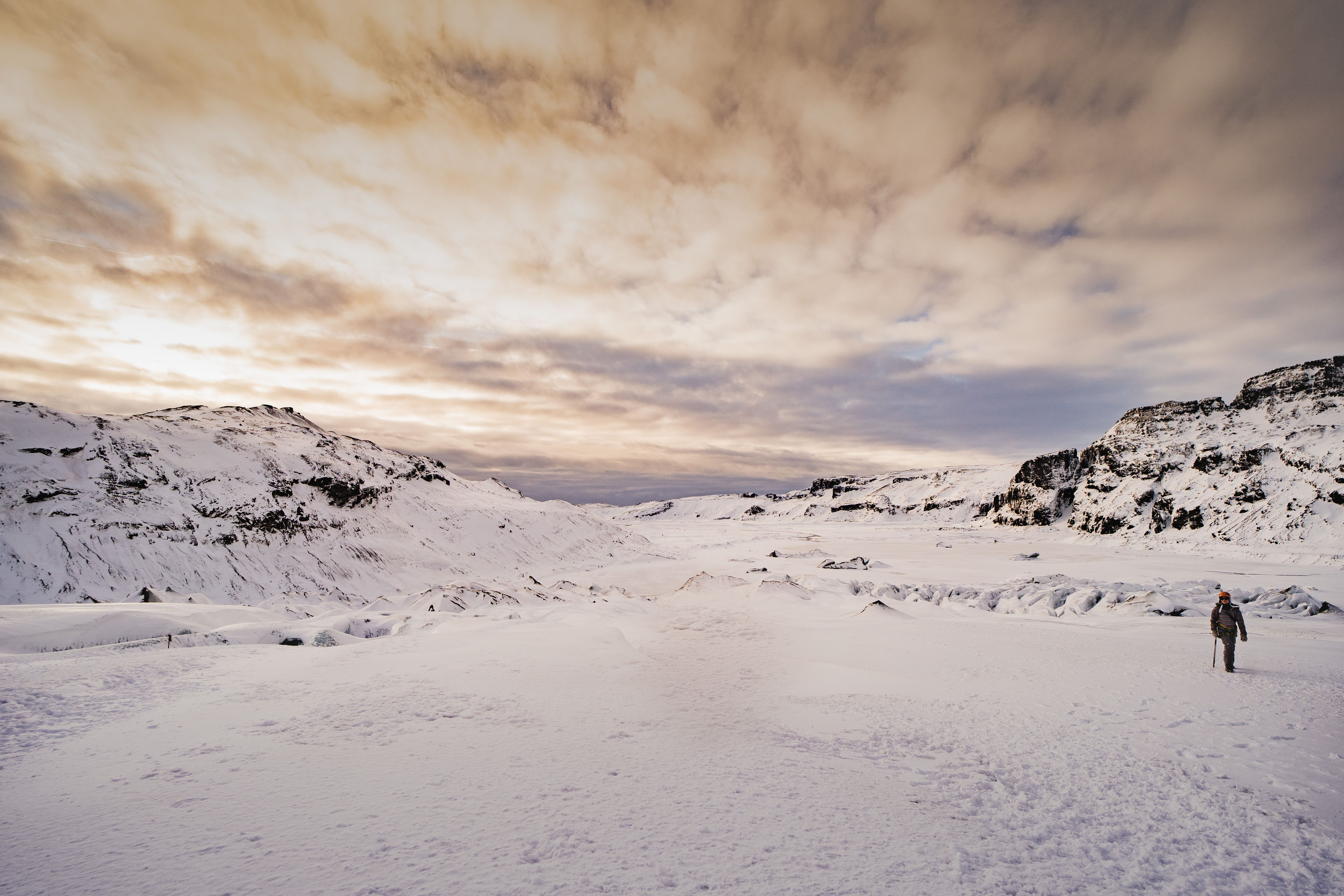 A Person Walking in a Snowy Landscape · Free Stock Photo
