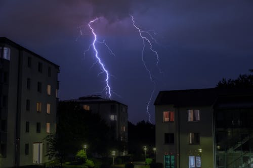 Lightning Strikes Over Concrete Buildings