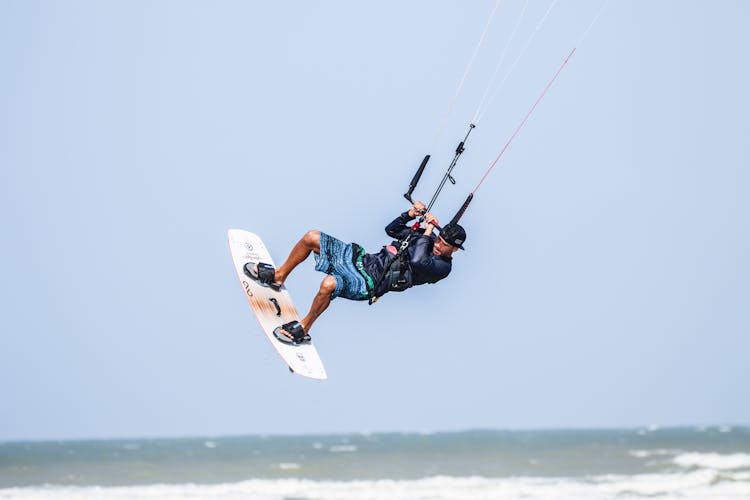 Man In Midair While Windsurfing