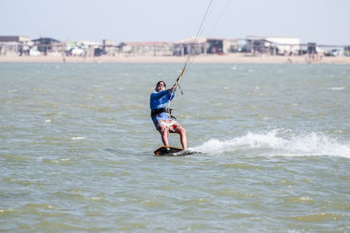 Photo of a Man Kitesurfing