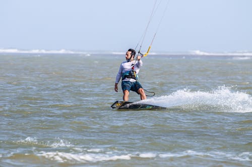 Photograph of a Man Kiteboarding