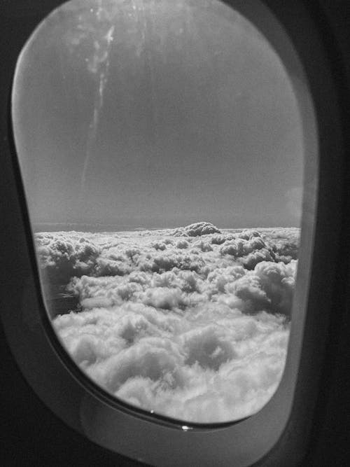 Free Grayscale Photo of Clouds from an Airplane Window Stock Photo