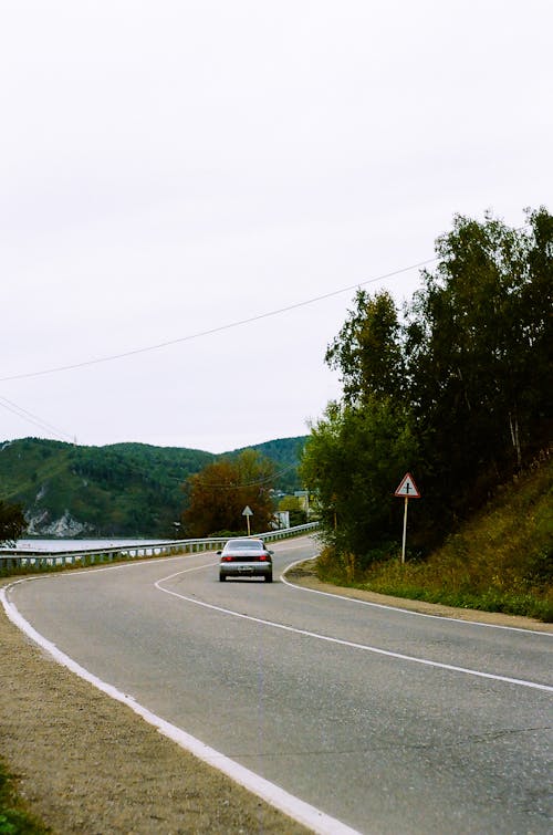 A Car Driving on the Road