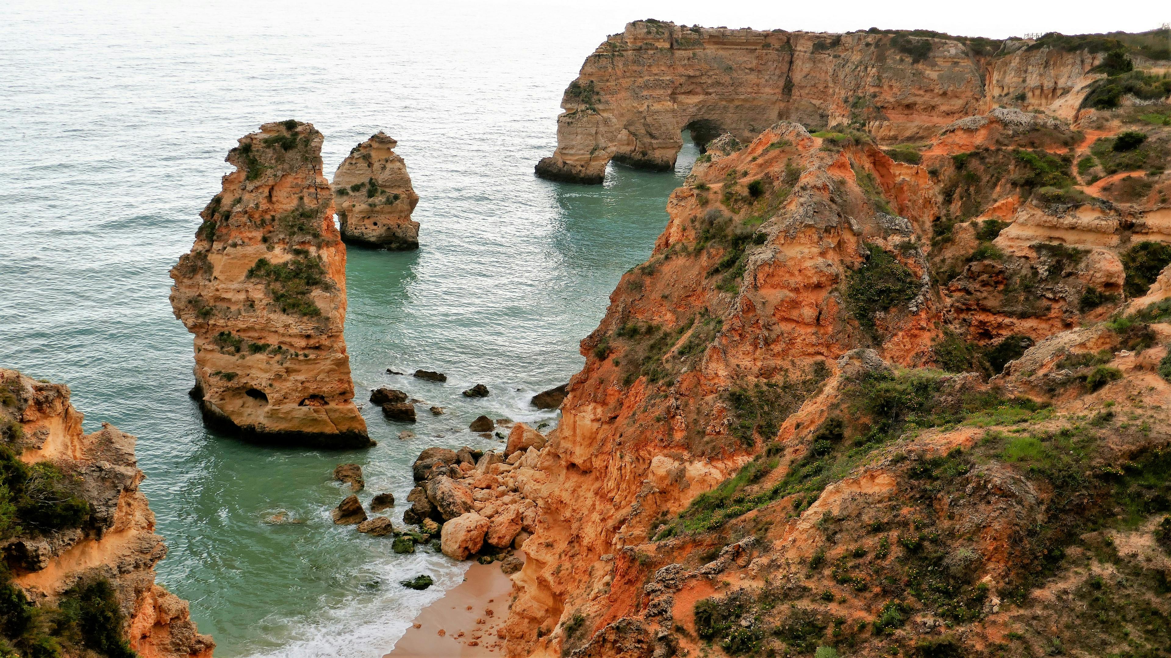 Free stock photo of blue-green sea, enchanting nature, orange rocks