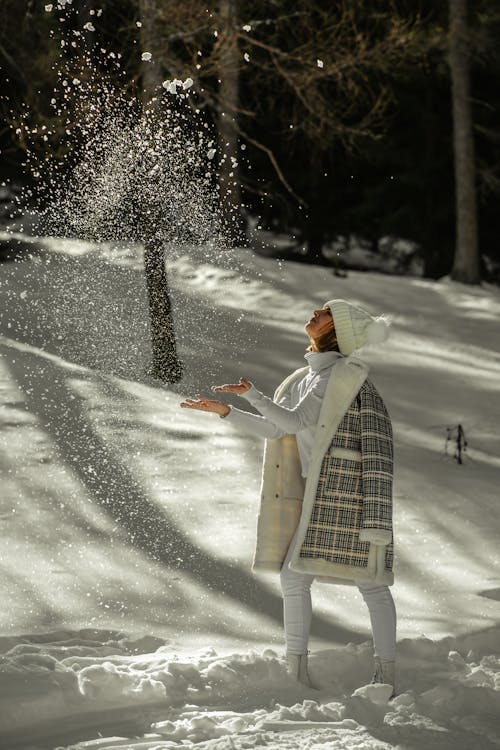 Woman Throwing Snow in the Air 