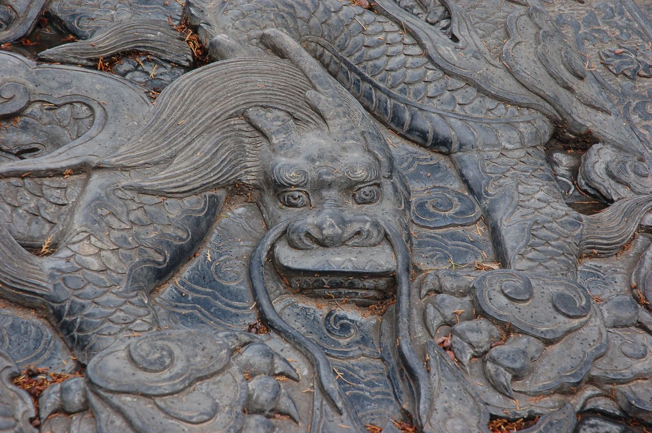 close up of an ornate dragon relief sculpture in zhengzhou china