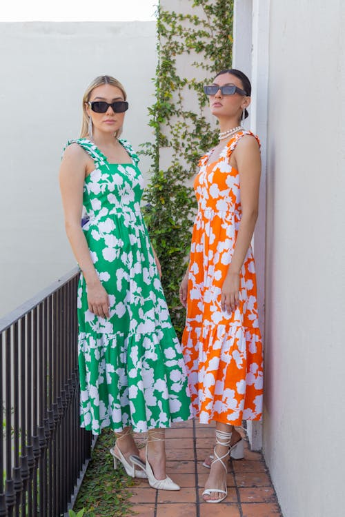 Free Two Women Wearing Floral Dresses Standing Stock Photo