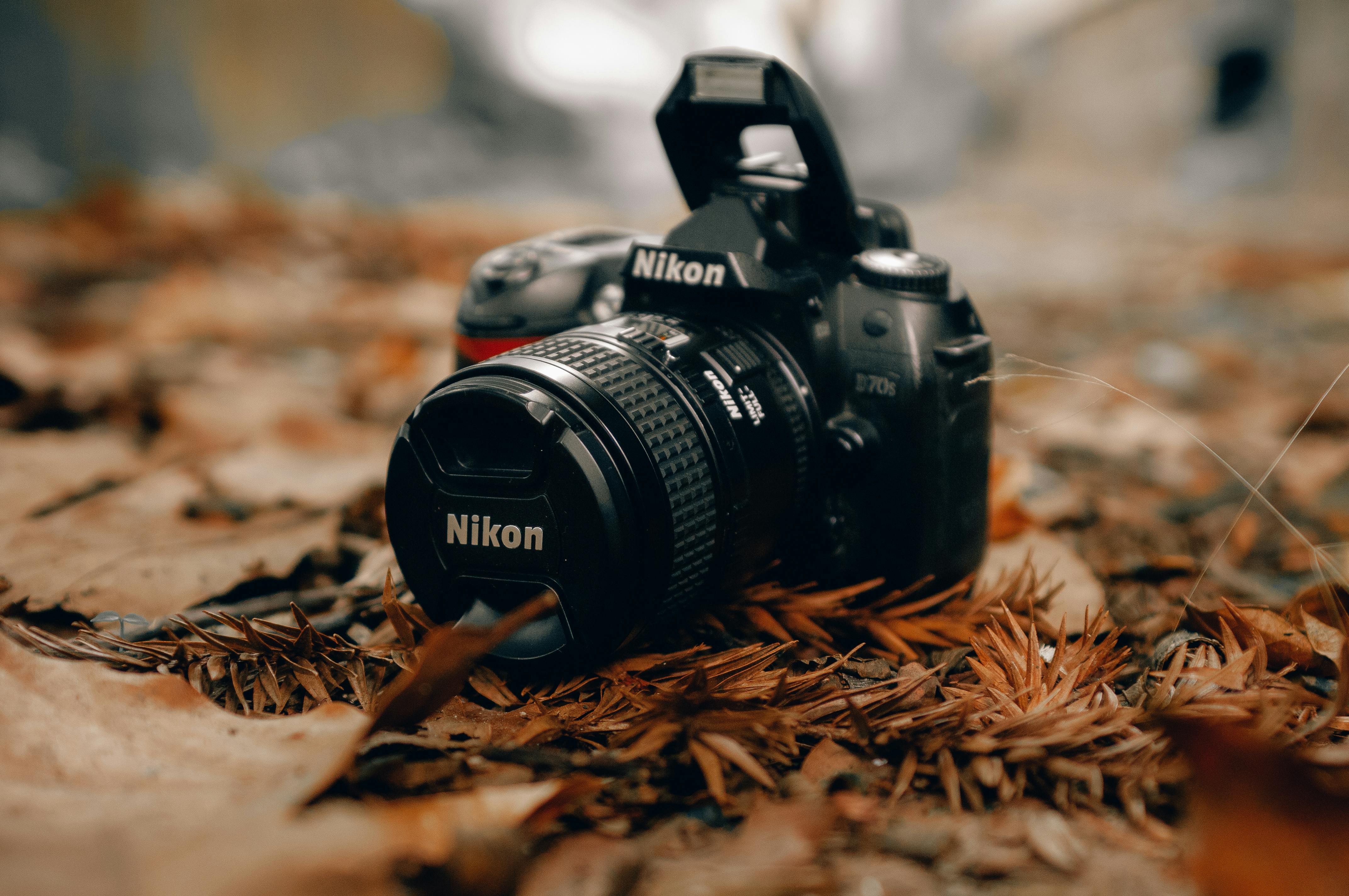 Close-Up Shot of a Nikon DSLR Camera · Free Stock Photo