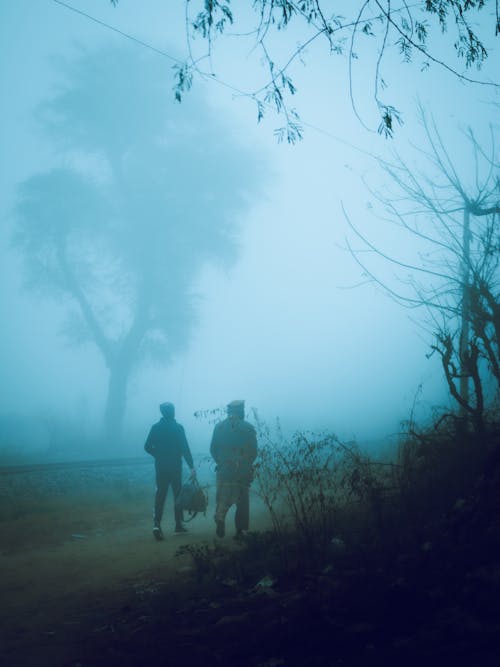 Men Walking on Dirt Road