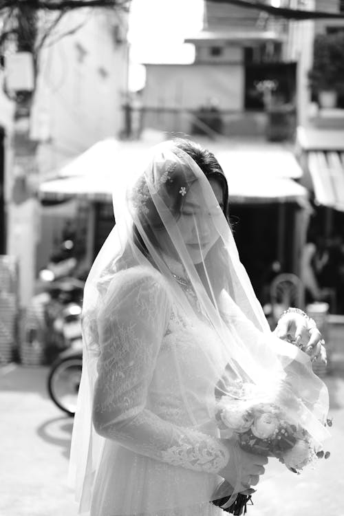 Grayscale Photo of a Bride 