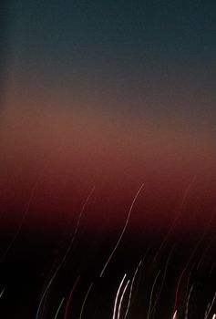 Captivating abstract view of night sky in Bangladesh with light trails against the dark horizon.