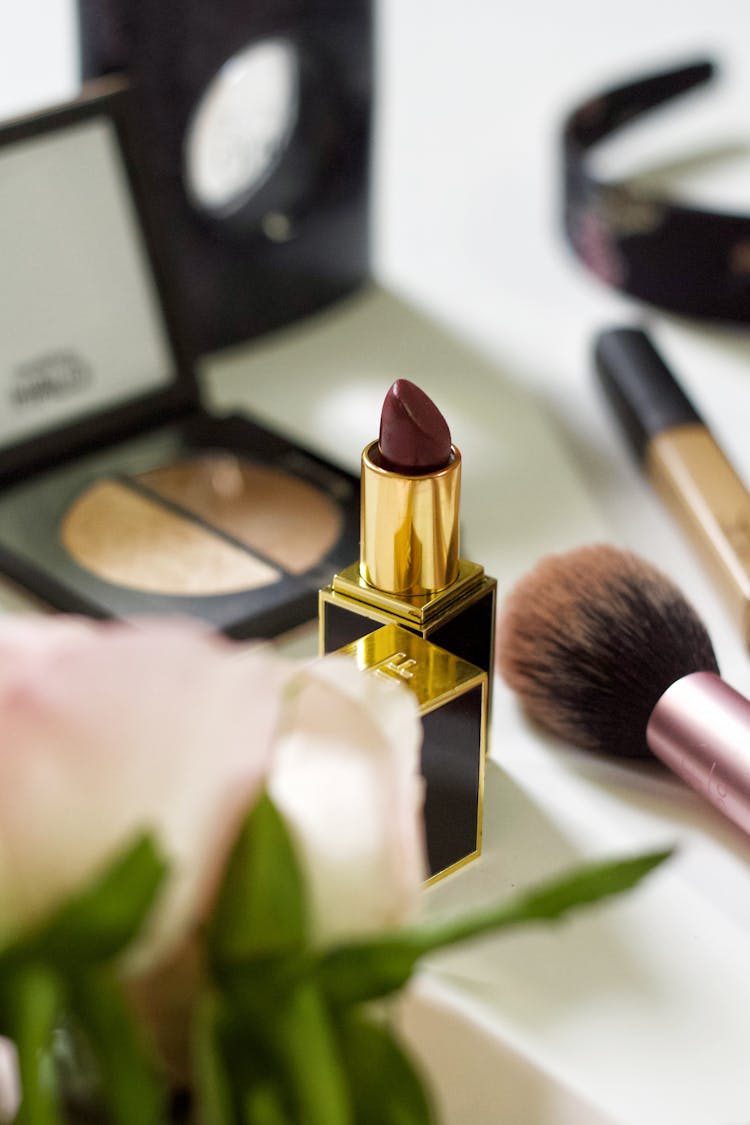 Dark Red Lipstick Among Other Makeup Cosmetics