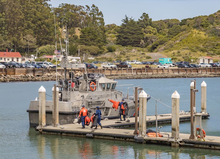 Workers Near Boat In Port