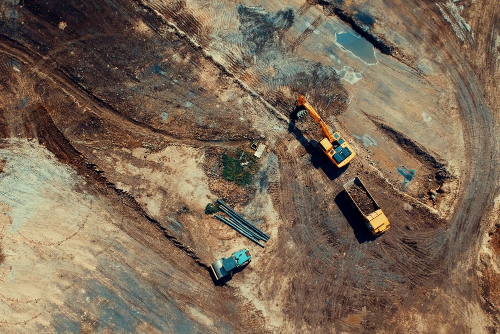 Aerial construction site with heavy equipment
