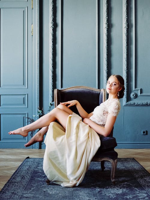 Woman Sitting across the Armchair 