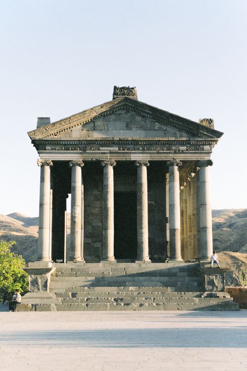 Free The iconic Temple of Garni, a classical landmark in Armenia, under blue skies. Stock Photo