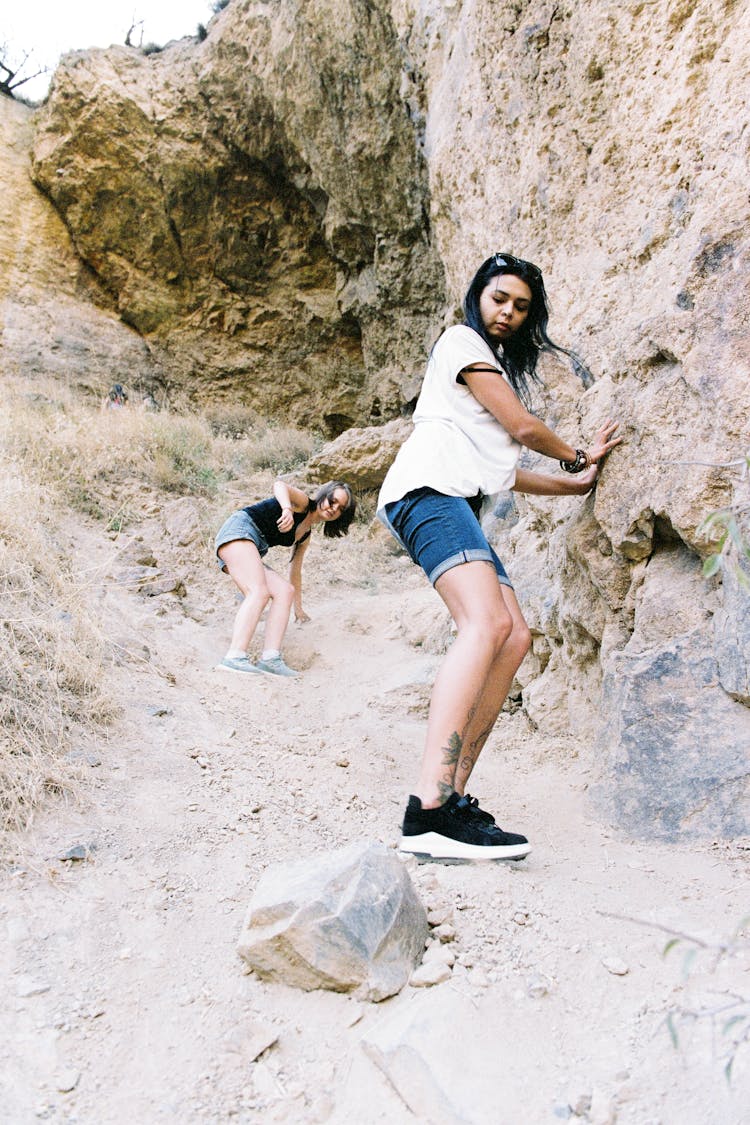 Women Walking Down A Steep Hill 