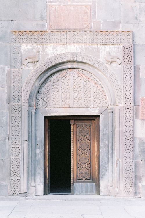 Free Intricately carved stone door at Geghard Monastery, a UNESCO World Heritage site in Armenia. Stock Photo