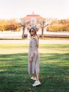Woman Fashion Model Posing in Shade of Tree in Park