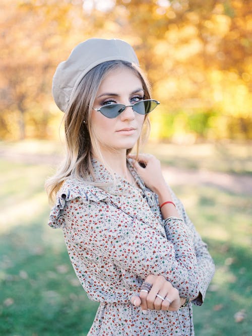 Young Woman Posing in Photo-Chrome Eyeglasses in Park