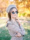 Young Woman Posing in Photo-Chrome Eyeglasses in Park