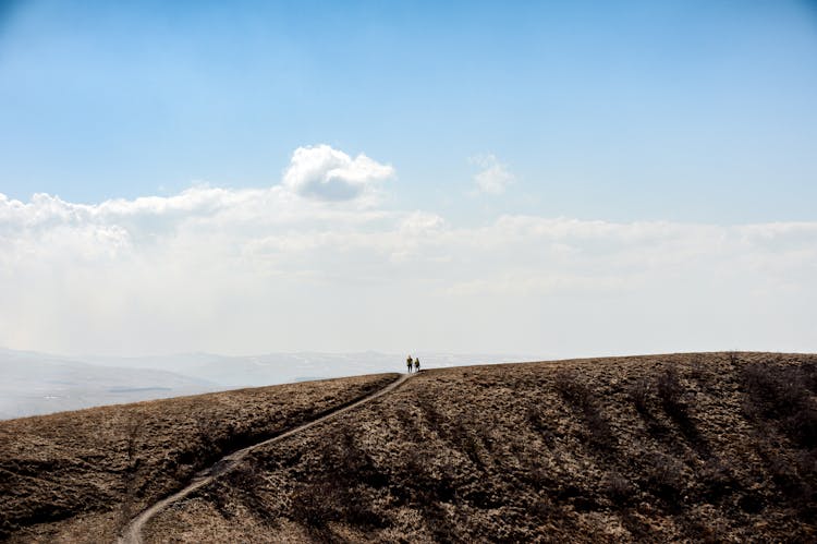 People Hiking In Mountains