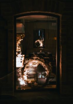 Intriguing abstract reflection captured in a dimly lit cafe interior, creating an artistic ambiance.