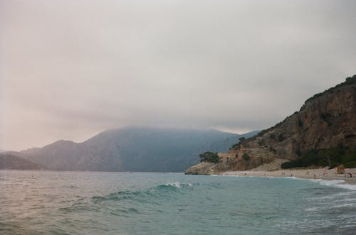 Fotos de stock gratuitas de dice adiós, mar, montañas