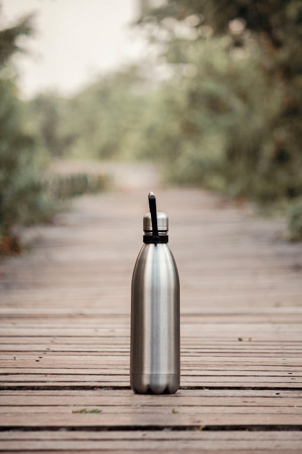 Vacuum Flask On Brown Wooden Dock