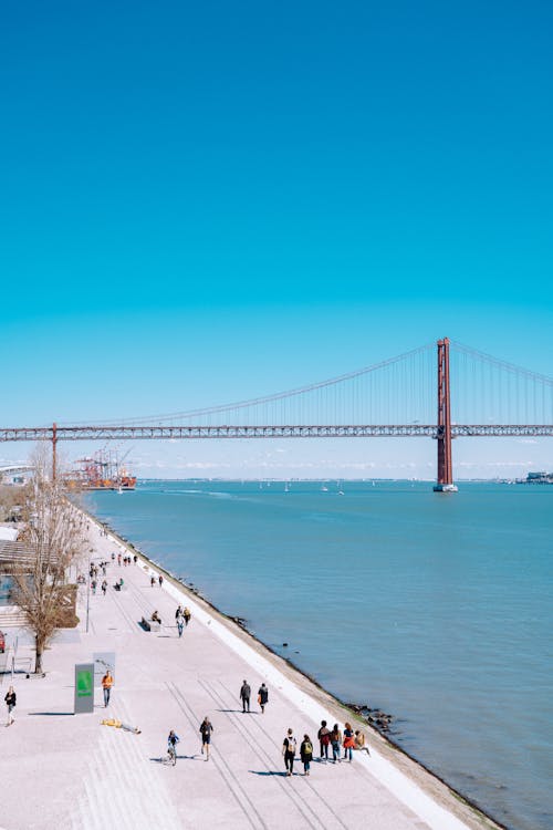 Free People Walking on the Bay  Stock Photo