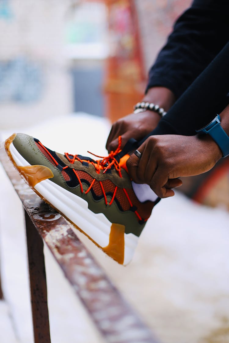 Closeup Of A Man Putting On A Shoe