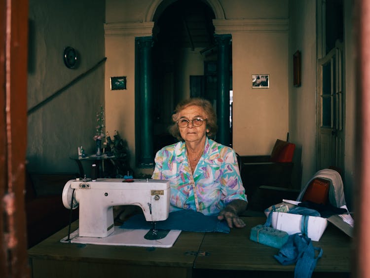 An Elderly Woman Sewing