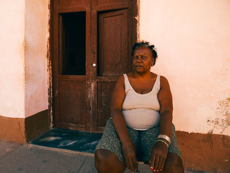 Woman Sitting By The Door 