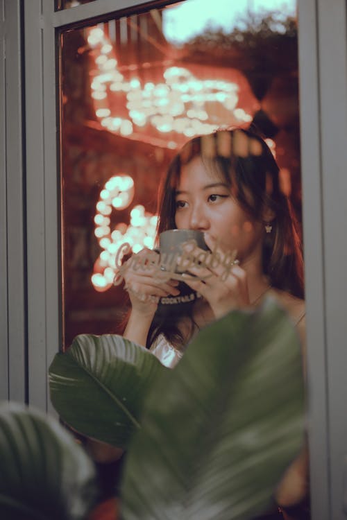 Photo of a Girl Drinking Coffee