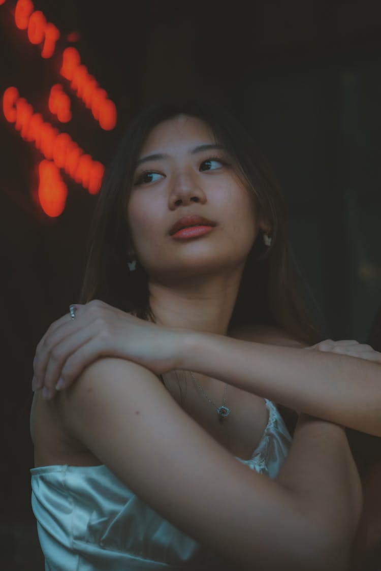 Portrait Of A Girl With Her Hand On Her Shoulder