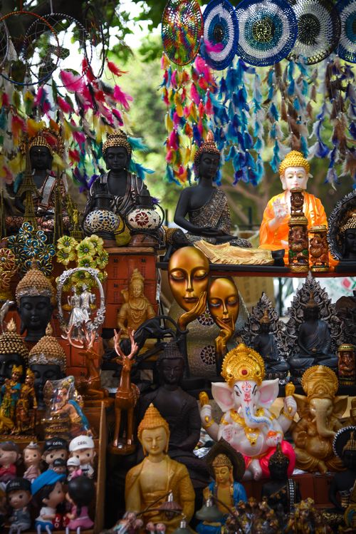 Free Vibrant display of spiritual figurines and dreamcatchers in a New Delhi market. Stock Photo