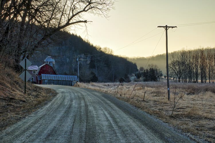 Barn House Near Bare Trees